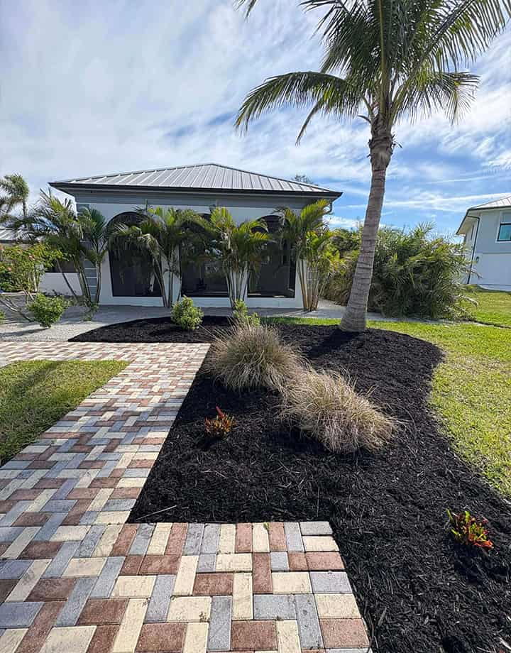 New mulch and rocks in the backyard planter beds of a Port Charlotte home.